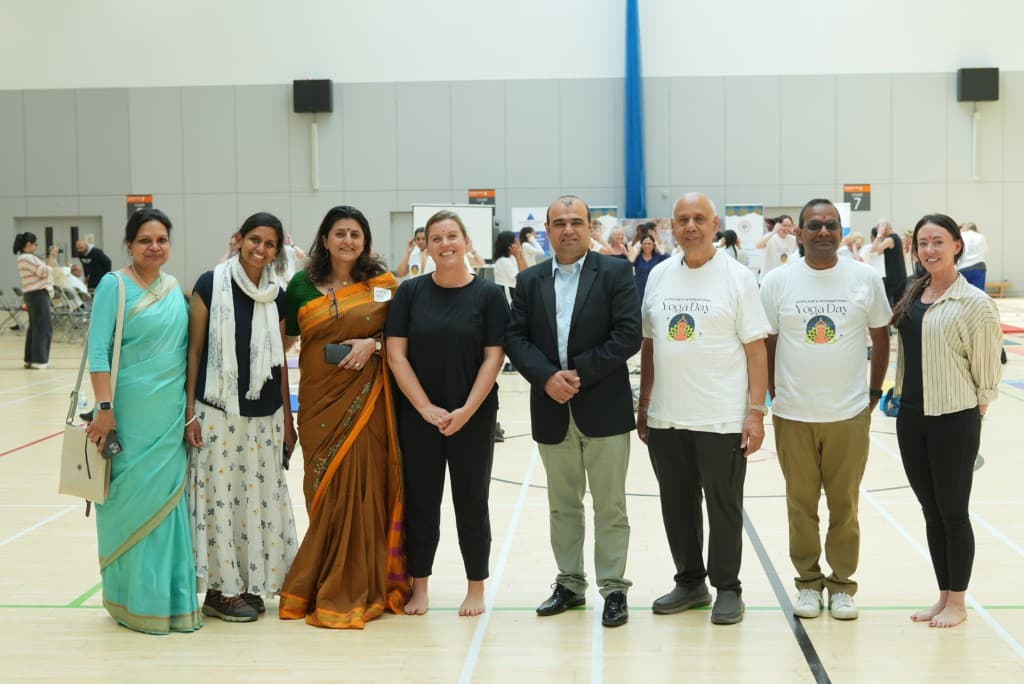 Community partners standing together at a yoga day event